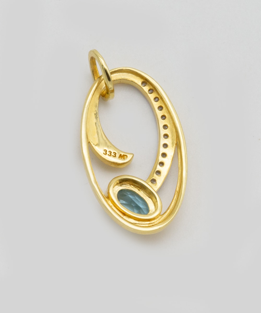 Anhänger Blautopas und Zirkonia 333er Gold bicolor